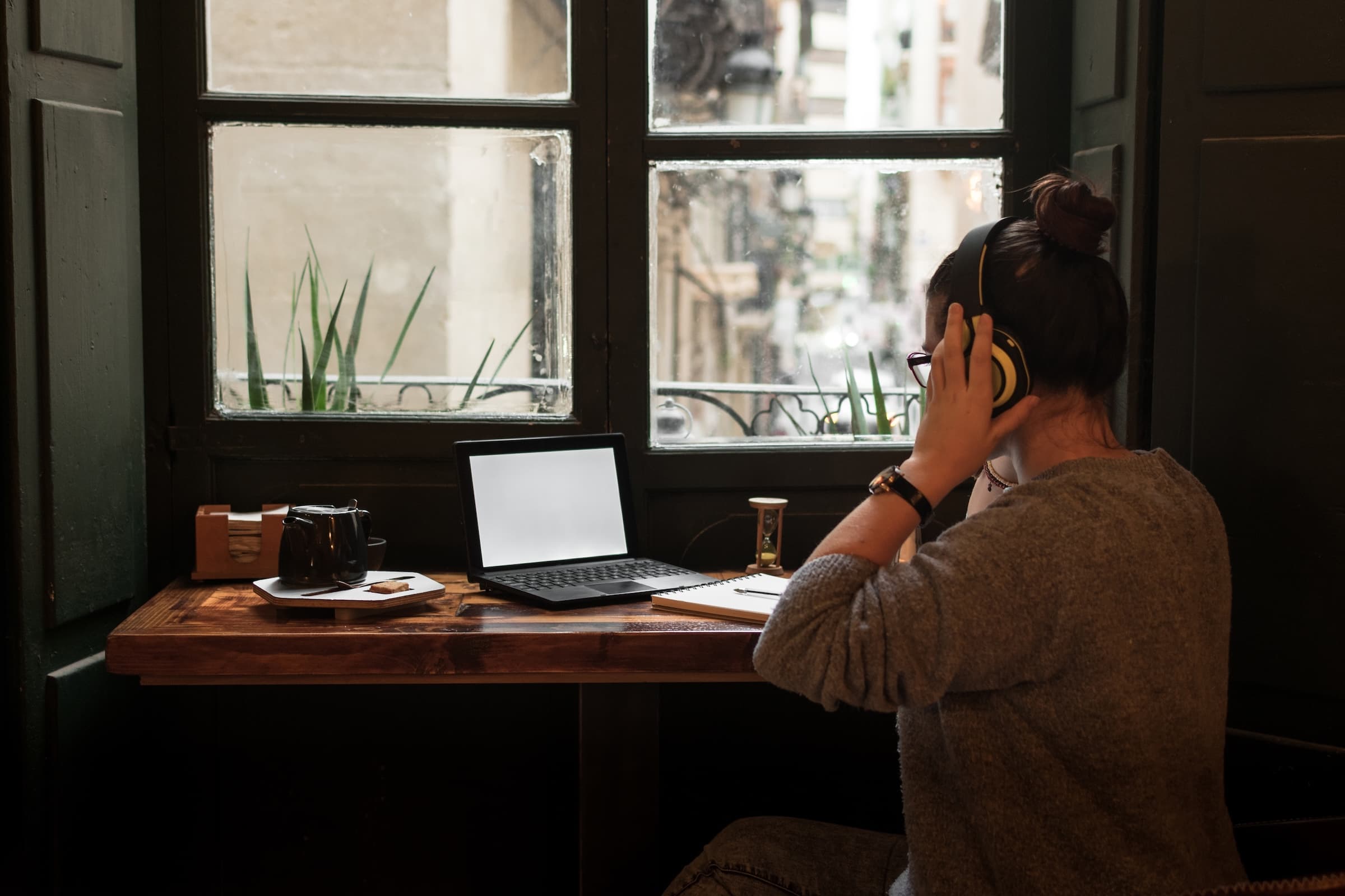 A young person studying with cinematic warm window light